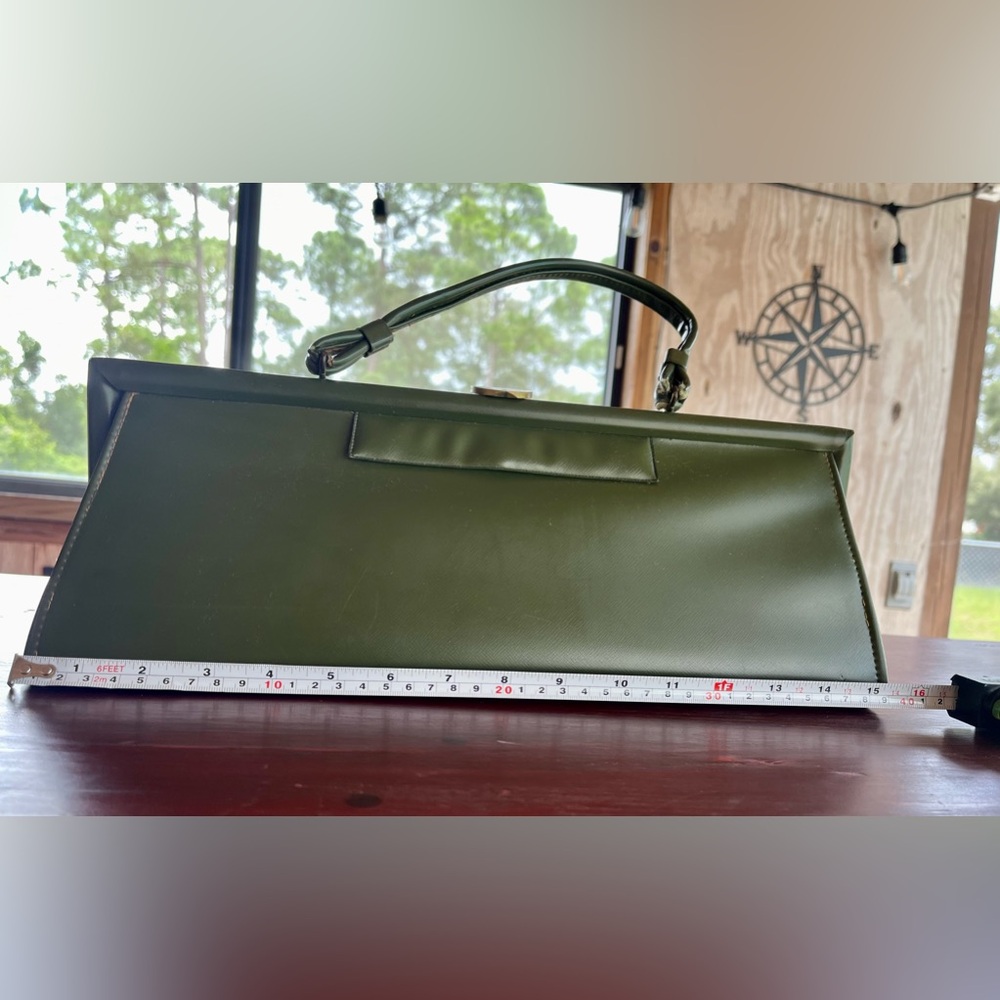 Vintage and rare long rectangular box purse in hunter green.